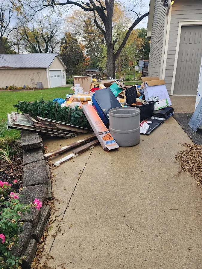 Dumpster being loaded with debris for Residential Dumpster Rental in River Forest